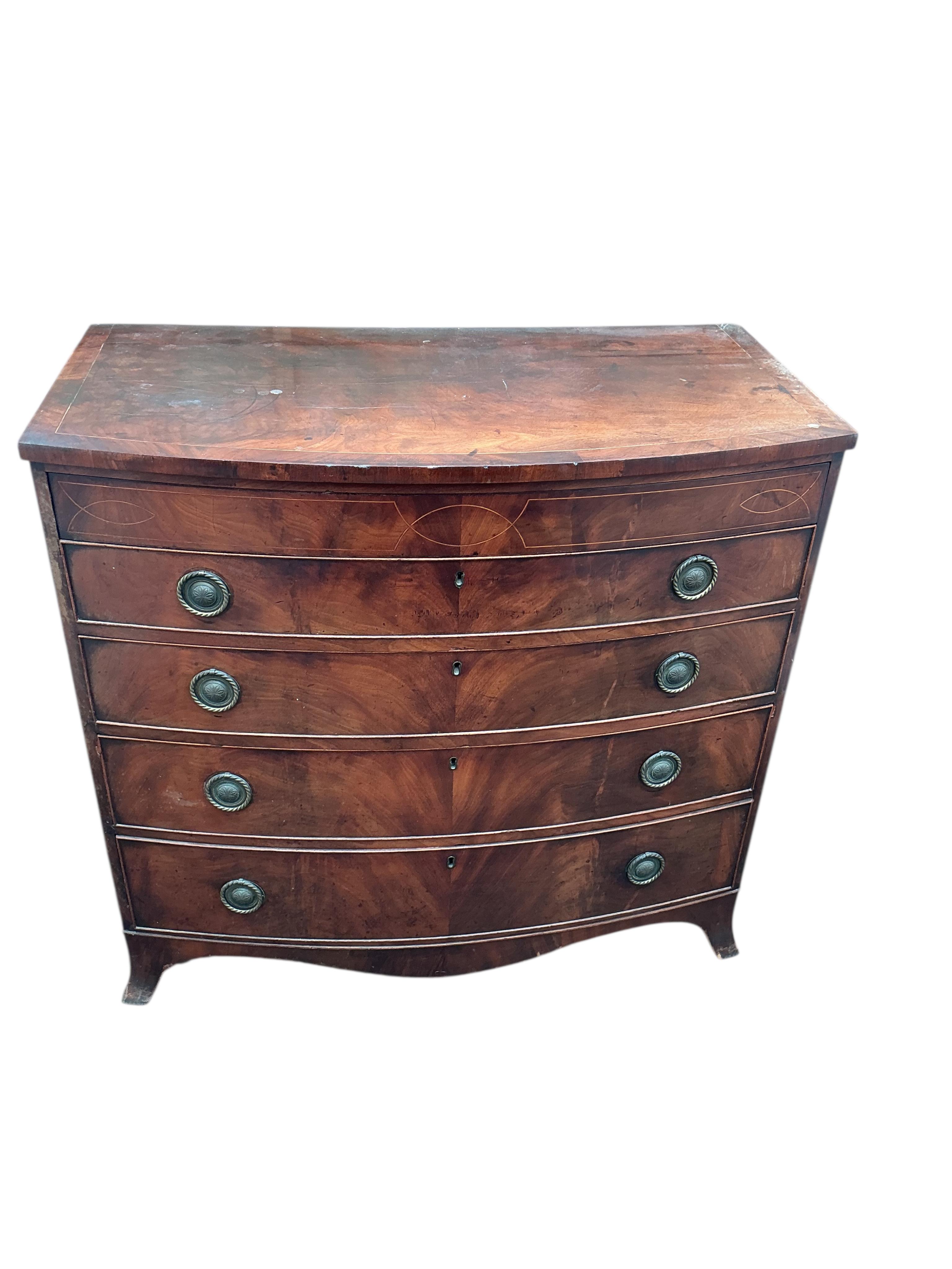 A Regency inlaid mahogany bowfront chest of drawers, width 106cm, depth 56cm, height 100cm